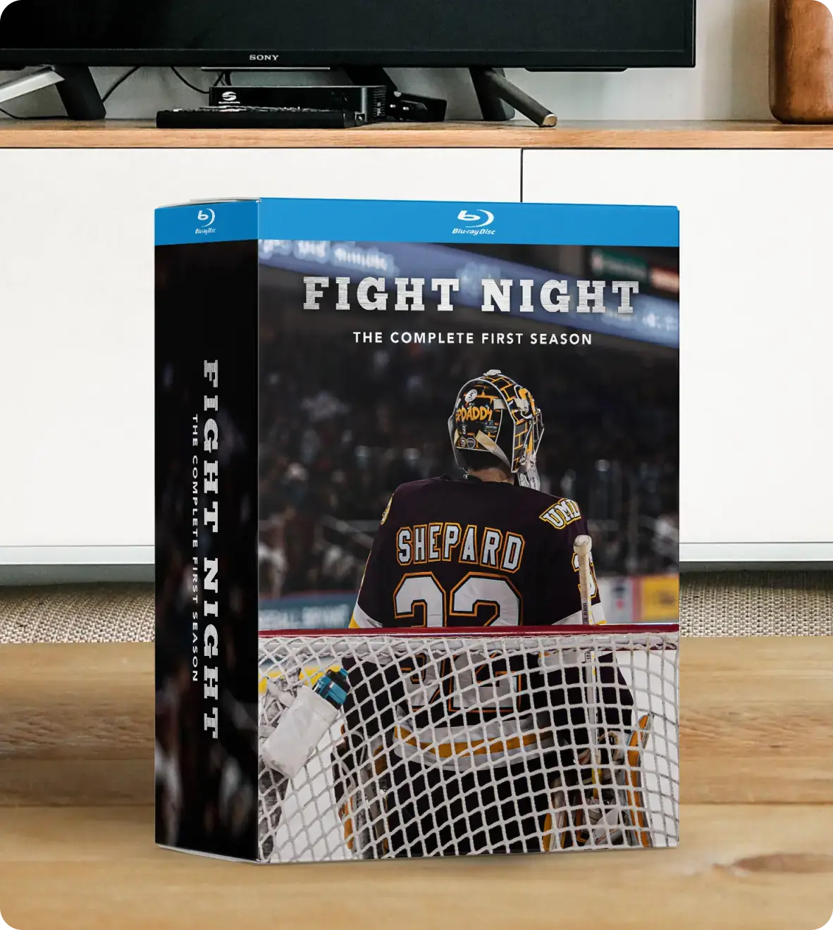 Blu-Ray box set titled 'Fight Night: The Complete First Season' featuring an image of a hockey goalie with the name 'Shepard' and number '32' on the back of the jersey, standing in front of a goal net.